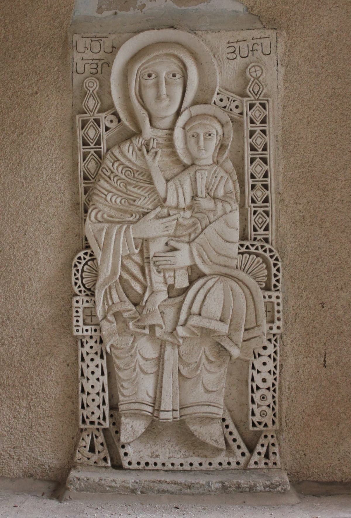 Virgin Mary and Child relief in the church courtyard — Beko, CC BY-SA 4.0 (https://creativecommons.org/licenses/by-sa/4.0/). https://commons.wikimedia.org/wiki/File:Virgin_Mary_with_baby_Jesus_in_backyard_of_Armenian_Apostolic_church_of_the_Holy_Archangels,_Jerusalem.jpg